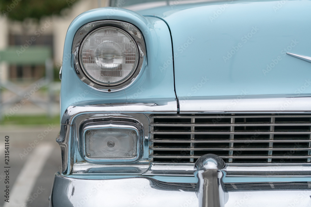 Close up of vintage blue car bumber and lamps