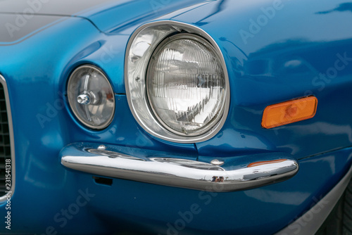 Close up of vintage blue car bumber and lamps