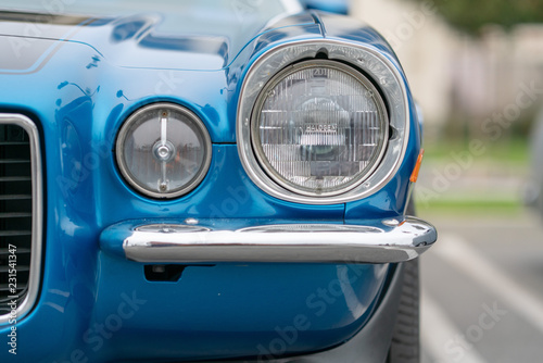Close up of vintage blue car bumber and lamps