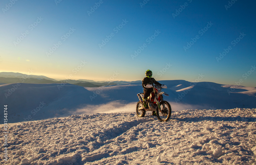 Fototapeta premium Motorcycle extreme sport bike winter snowy mountains