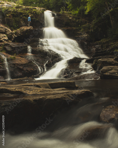 Wallpaper Mural little figure next to a large waterfall Torontodigital.ca