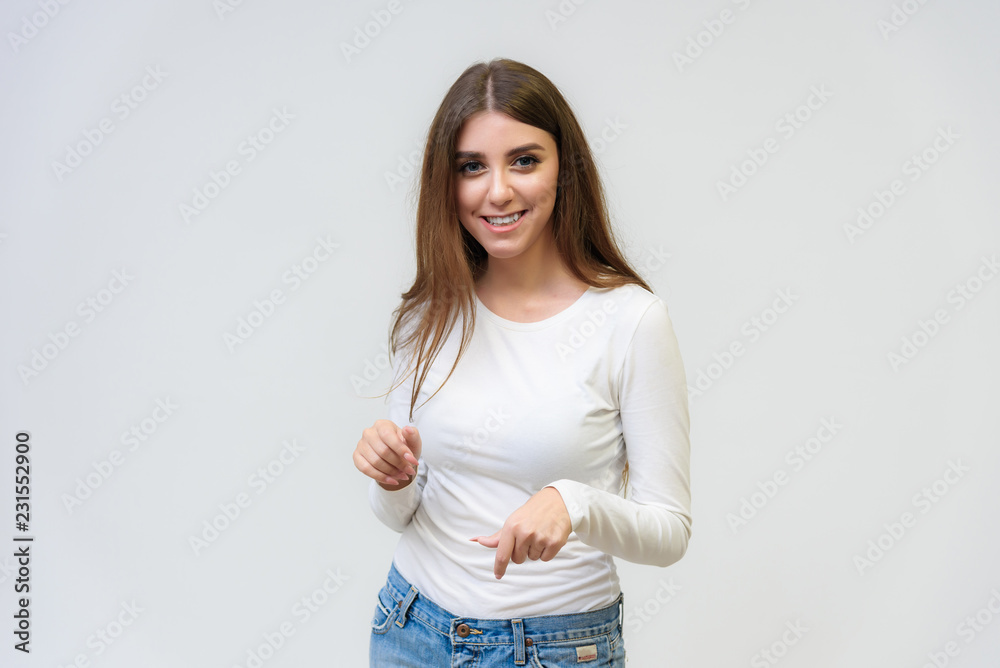 Studio portrait of a smiling happy beautiful brunette girl on white background. Studio portrait of a smiling happy beautiful brunette girl on white background.