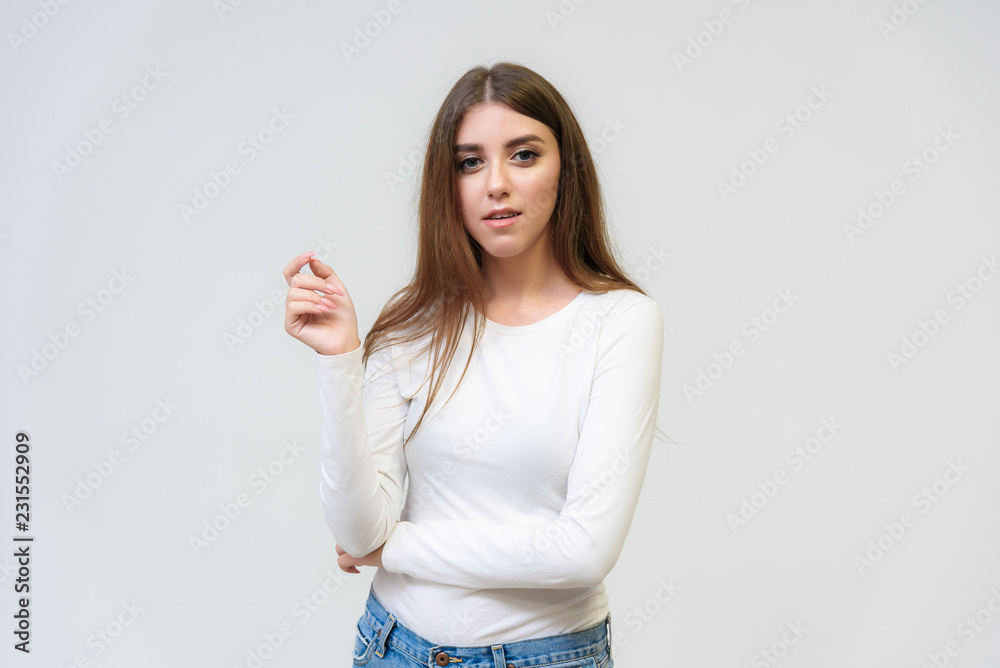 Studio portrait of a smiling happy beautiful brunette girl on white background. Studio portrait of a smiling happy beautiful brunette girl on white background.
