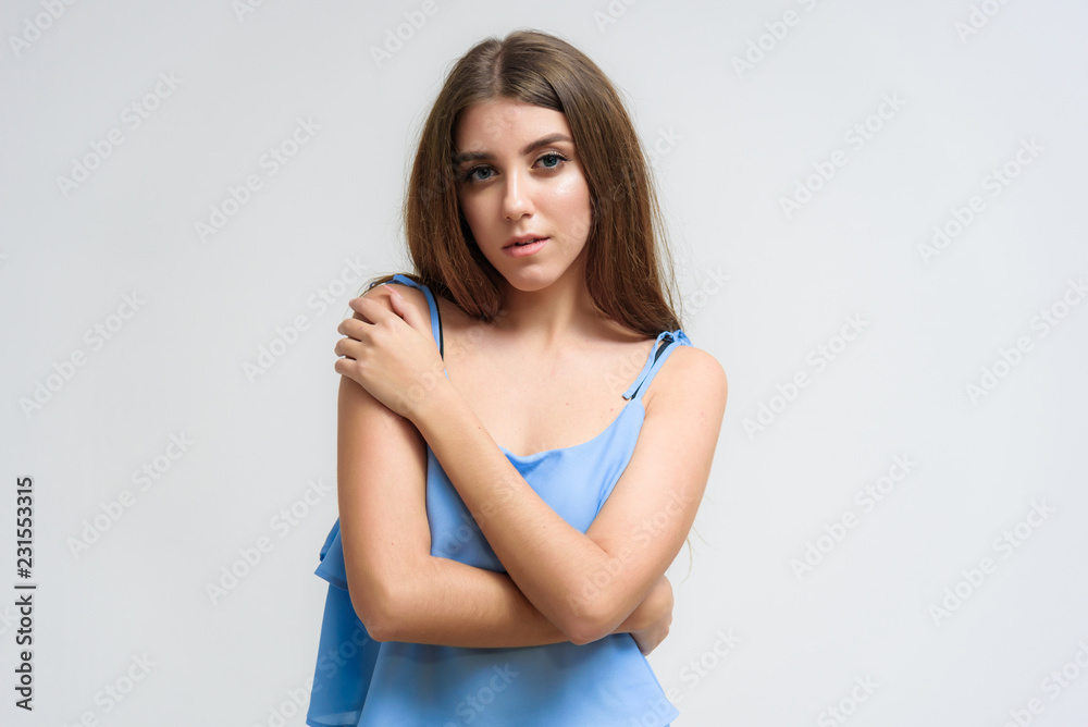 Studio portrait of a smiling happy beautiful brunette girl on white background. Studio portrait of a smiling happy beautiful brunette girl on white background.