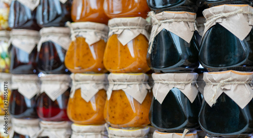 Multicolored fruit and berry jam in glass jars. © sandipruel