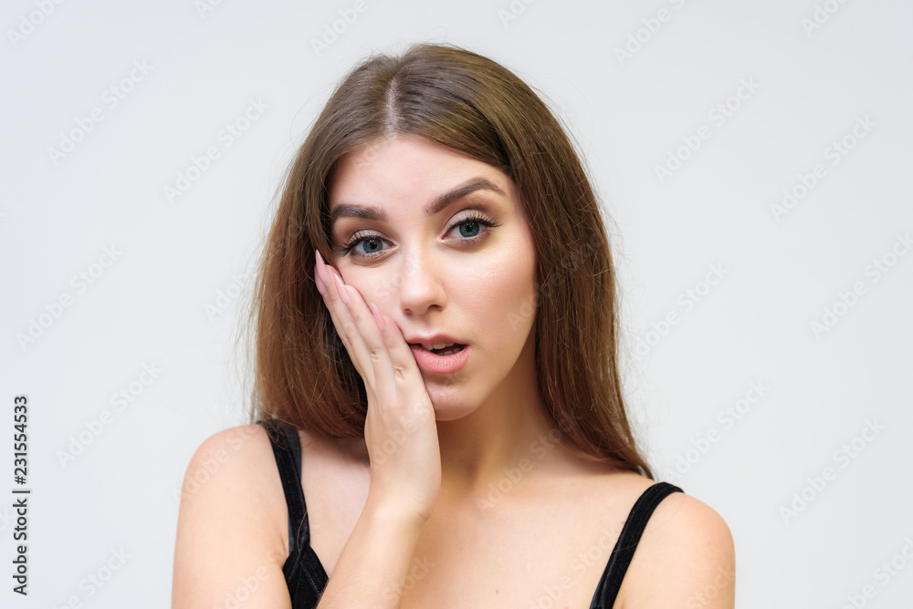 Studio portrait of a smiling happy beautiful brunette girl on white background. Studio portrait of a smiling happy beautiful brunette girl on white background.