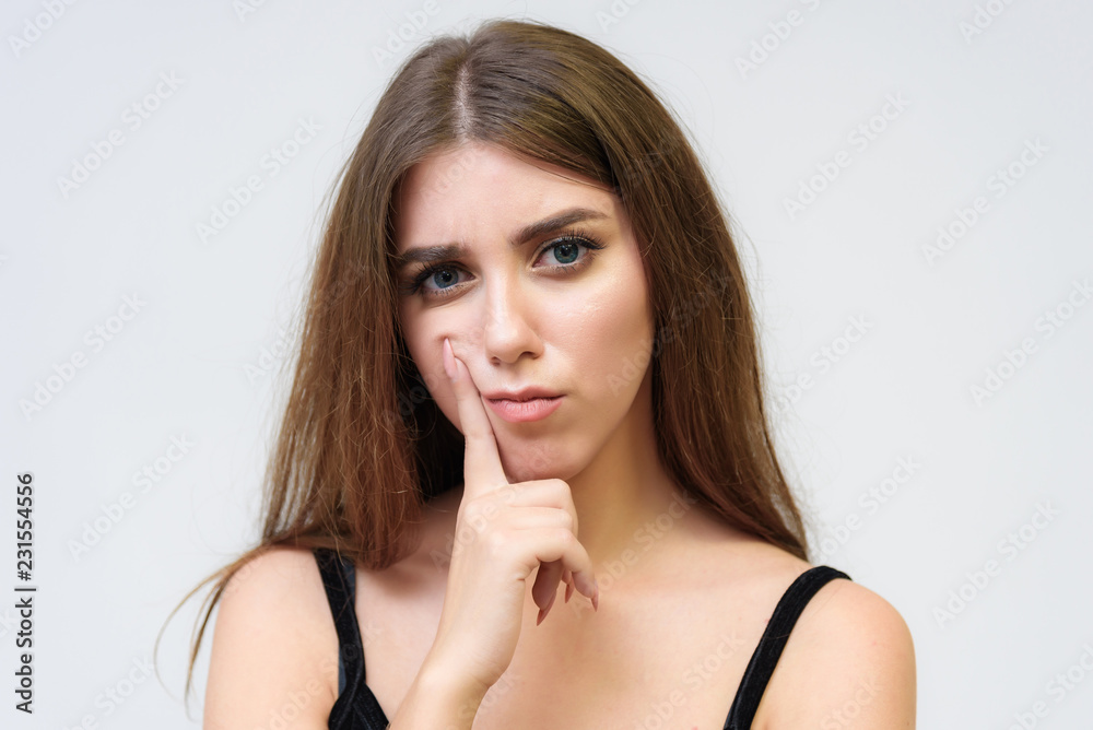 Studio portrait of a smiling happy beautiful brunette girl on white background. Studio portrait of a smiling happy beautiful brunette girl on white background.