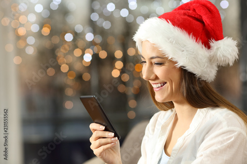 Woman sending christmas messages on phone