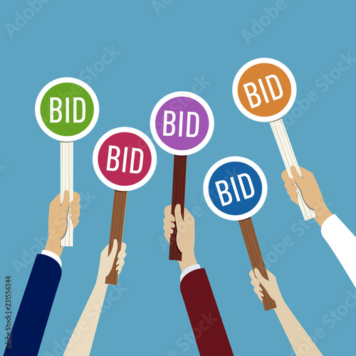 Hands holding auction paddle with bid photo
