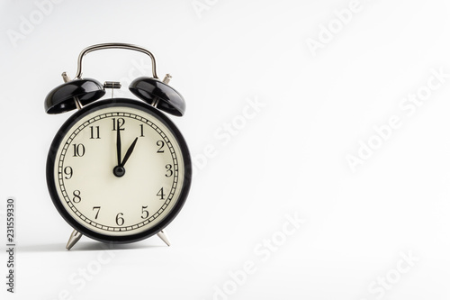 Clock isolated on white background with selective focus and crop fragment