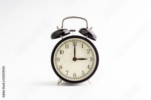 Clock isolated on white background with selective focus and crop fragment