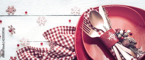 Christmas dinner cutlery on a white wooden background
