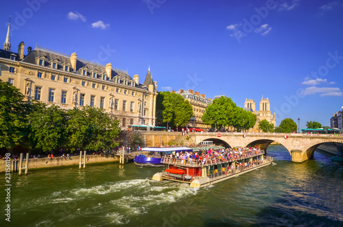 Bridge Pont au Change and buildings near the Seine river in Paris, France photo