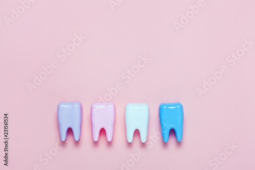 Big teeth on pink background. Minimal