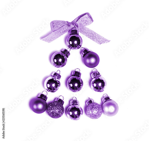 Minimalistic Christmas concept. Christmas tree made frome ultraviolet christmas balls isolated on white.