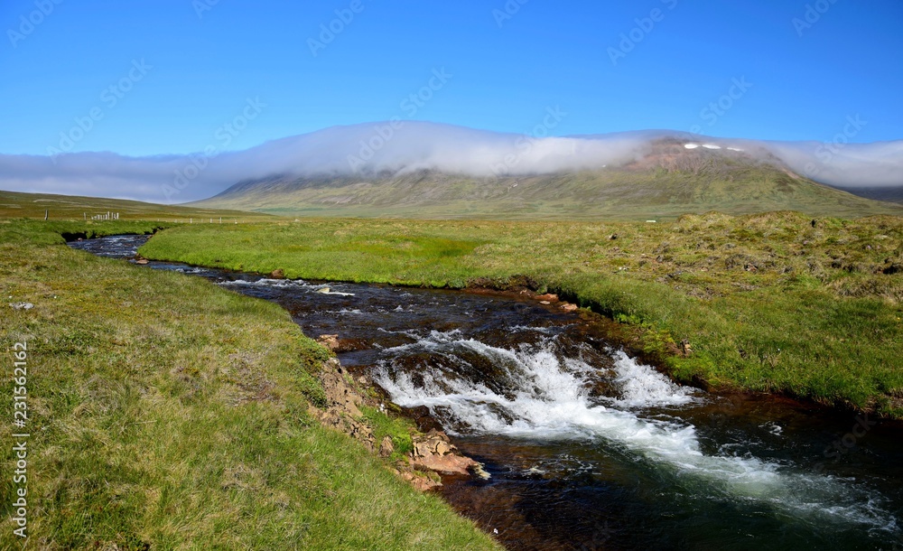 Icelandic landscape with a river and a mountain. Peninsula Skagi. Icelandic landscape with a river and a mountain. Peninsula Skagi.
