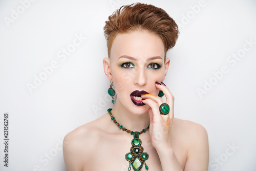 woman creative haircut green make up