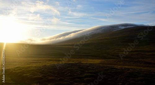 A midsummer night in Iceland. Clouds are floating down a mountain. © Susanne Fritzsche