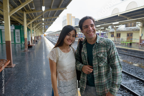 Persian tourist man and young Asian tourist woman together at th