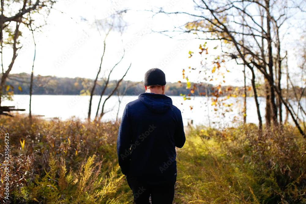 Man Walking On A Nature Walk In Autumn