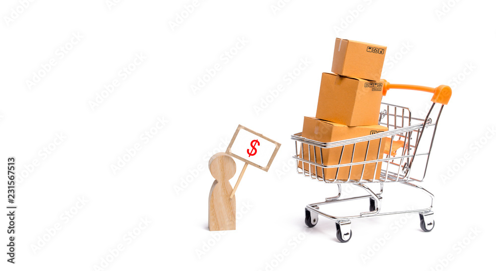 A tower of cardboard boxes and a figure of a man with a sign in his hands. A man sells his goods.. The concept of online sales, shopping and online shopping. Realization of goods and services