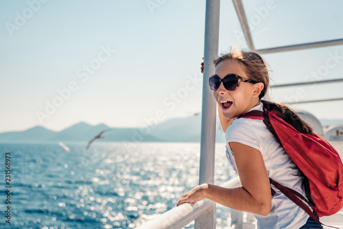 Girl standing on a ship deck at ferry