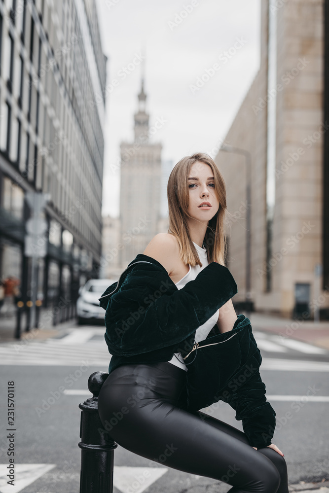 Model looking girl pose on the city street Model looking girl pose on the city street