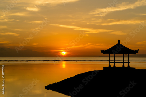 Silhouette of a small pavilion during sunrise