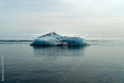 Melting iceberg floating on the ocean