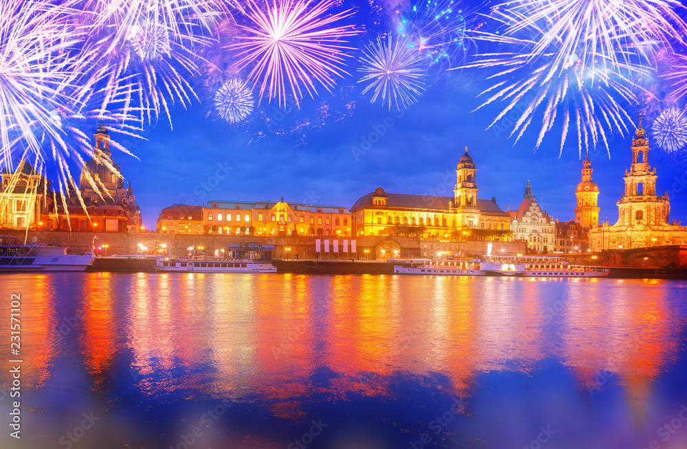 Embankment of Dresden and river Elbe at night with fireworks, Germany