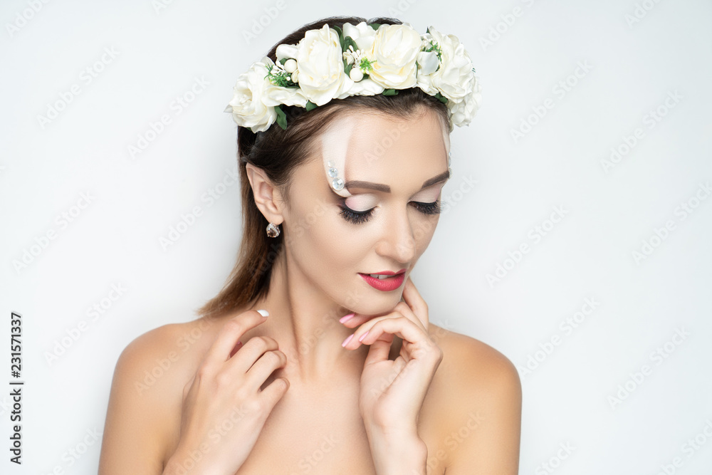woman wearing massive flower wreath woman wearing massive flower wreath