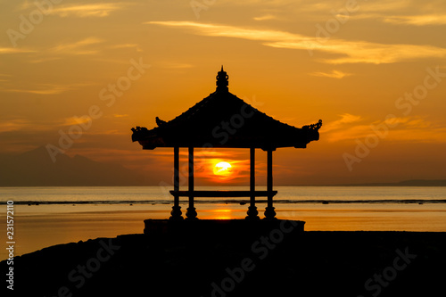 Silhouette of a small pavilion during sunrise