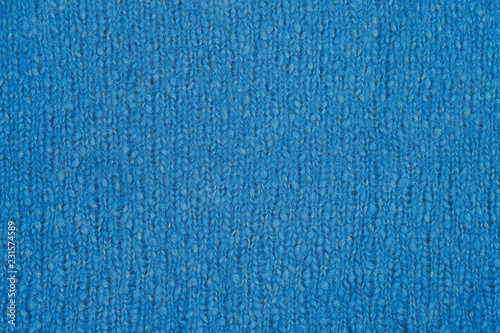 Blue knitted texture. Handmade Knitwear. Background
