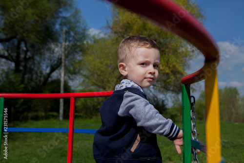 The child is riding a carousel, a healthy lifestyle consept photo