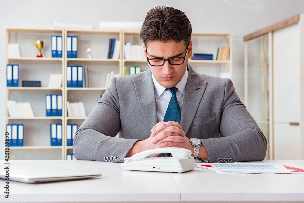 Businessman expecting important call on phone Businessman expecting important call on phone