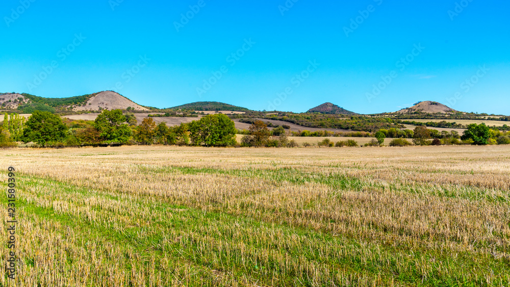 Landscape of Ceske Stredohori, aka Central Bohemian Highlands, with typical spiky hills of volcanic origin, Czech Republic.