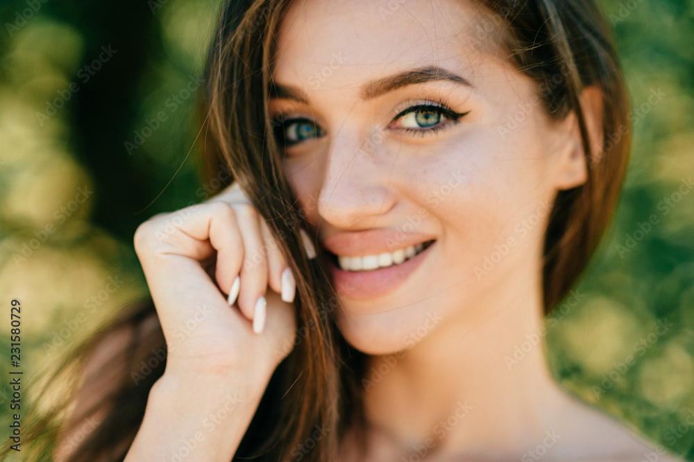 Closeup lifestyle portrait of celebrity female model. Beautiful girl face on abstract nature background. Cheerful amazing young woman face expression. Sexy blue eyed babe. Glamour youth appearance. Closeup lifestyle portrait of celebrity female model. Beautiful girl face on abstract nature background. Cheerful amazing young woman face expression. Sexy blue eyed babe. Glamour youth appearance.
