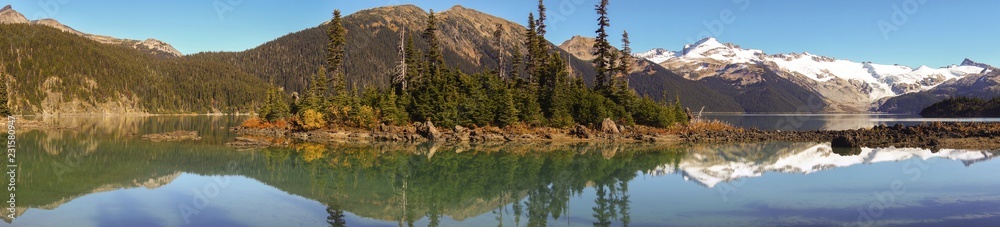Wide Panoramic Scenic Landscape View of Garibaldi Lake and Distant Coast Mountains British Columbia Canada Wide Panoramic Scenic Landscape View of Garibaldi Lake and Distant Coast Mountains British Columbia Canada