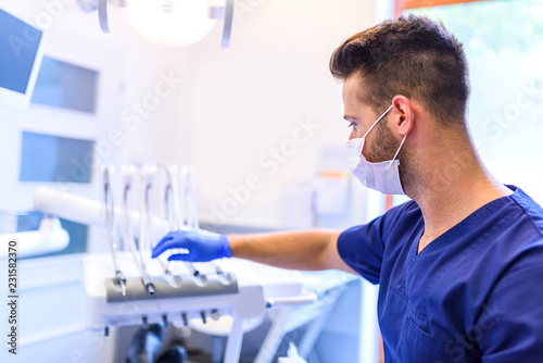 A Dentist working in his Practice