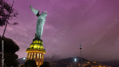 Night view of Virgen de El Panecillo or Virgen de Legarda. It is located on the top of Panecillo hill near the historical center of the city of Quito. Ecuador photo