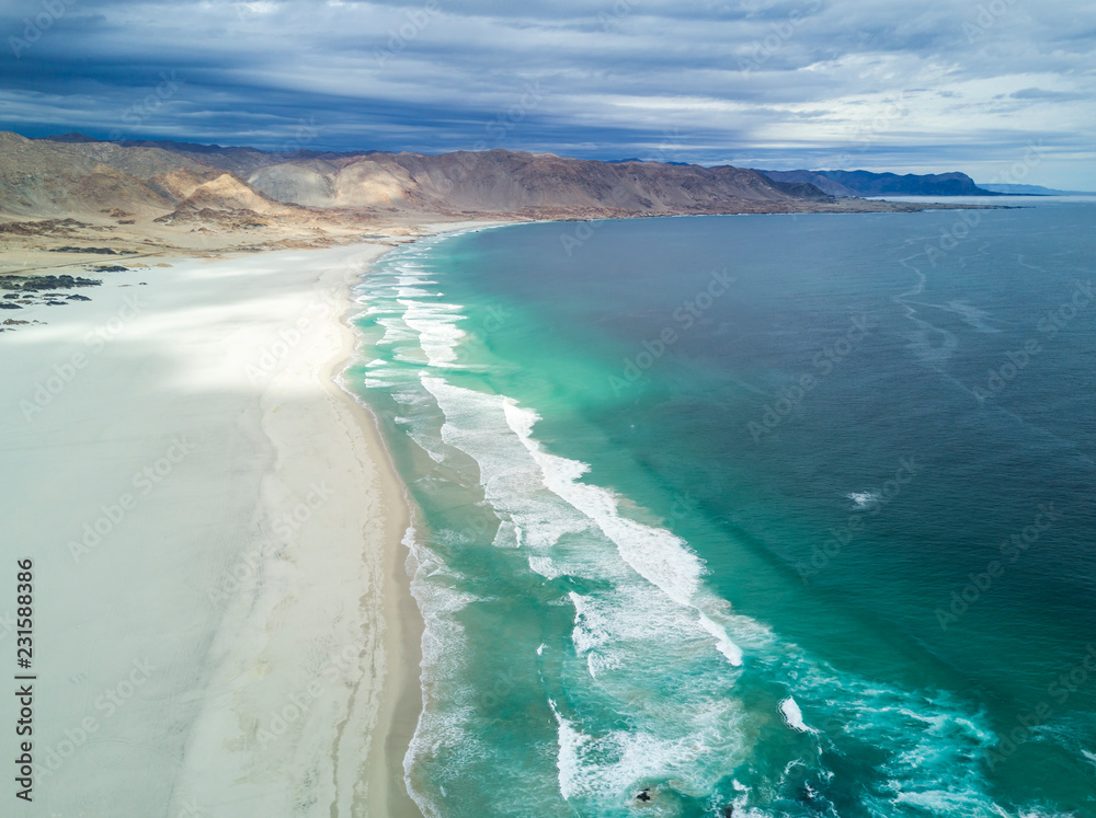 An aerial view of Pan de Azucar National Park, Atacama Desert, at the coast area an amazing landscape for geology with incredible sand formations and folds in the Earth in Playa Blanca, Copiapo, Chile