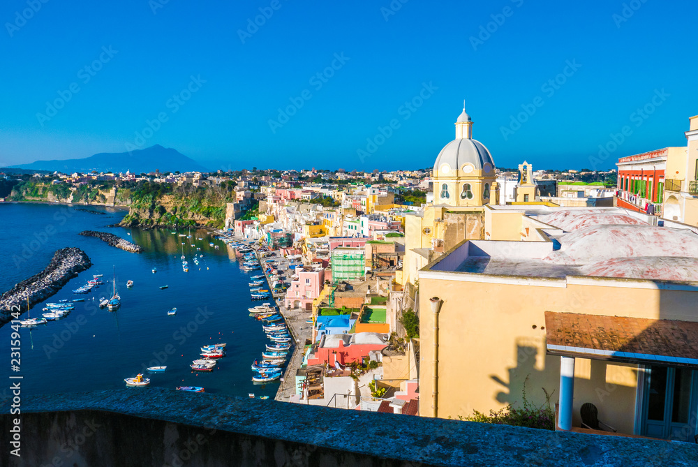 Fototapeta Perfect tiny seaside village with multi colored houses of Marina di Corricella, Procida Island, Naples Italy
