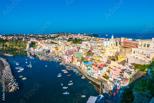Perfect tiny seaside village with multi colored houses of Marina di Corricella, Procida Island, Naples Italy