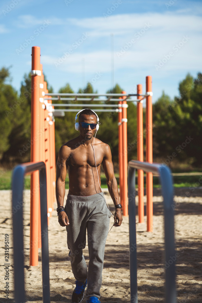 Fototapeta premium A male athlete training outdoors.