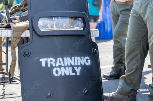 Armored shield used by police and SWAT with "training only" sign on it.