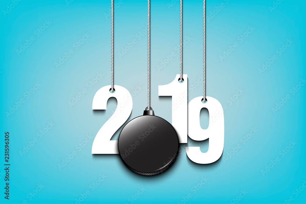 2019 New Year and hockey puck hanging on strings 2019 New Year and hockey puck hanging on strings