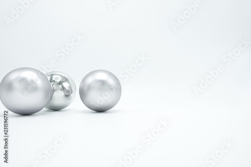Silver Christmas balls on white.