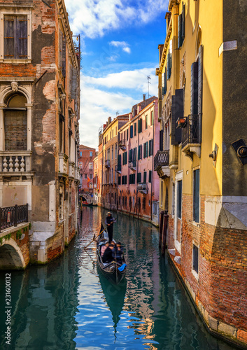 Canal with gondolas in Venice, Italy. Architecture and landmarks of Venice. Venice postcard with Venice gondolas.