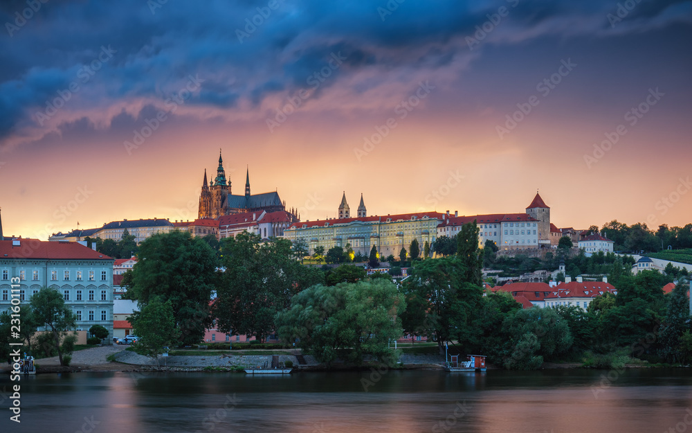 Prague old town including Prague castle in the background, one of the most famous landmarks of Prague at sunset with dramatic sky. Prague old town including Prague castle in the background, one of the most famous landmarks of Prague at sunset with dramatic sky.