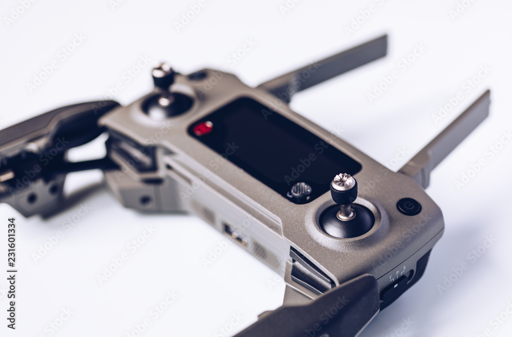 New modern drone on display on white background. Drone quadcopter with digital camera. New modern drone on display on white background. Drone quadcopter with digital camera.